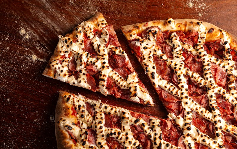 Meat Lovers pizza piled high with assorted meats